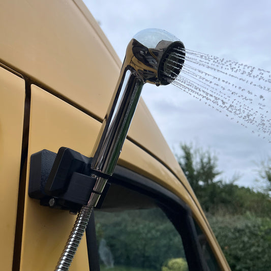 Magnetic and adjustable van/motorhome shower head holder